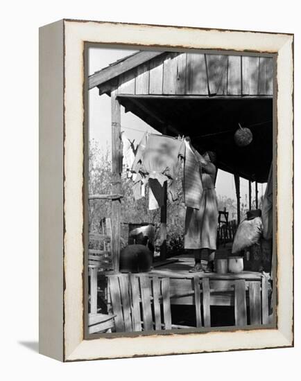 Old African American, Wife of Sharecropper, Lizzie Alexander Hanging Laundry to Dry on Her Porch-Alfred Eisenstaedt-Framed Premier Image Canvas