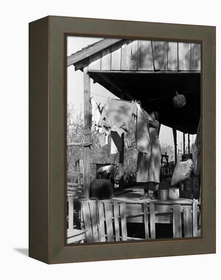 Old African American, Wife of Sharecropper, Lizzie Alexander Hanging Laundry to Dry on Her Porch-Alfred Eisenstaedt-Framed Premier Image Canvas