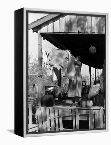 Old African American, Wife of Sharecropper, Lizzie Alexander Hanging Laundry to Dry on Her Porch-Alfred Eisenstaedt-Framed Premier Image Canvas