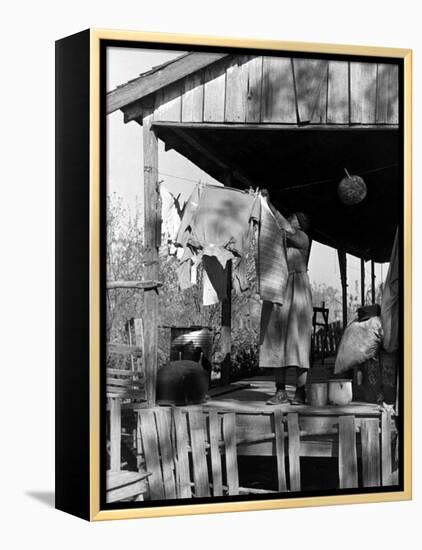 Old African American, Wife of Sharecropper, Lizzie Alexander Hanging Laundry to Dry on Her Porch-Alfred Eisenstaedt-Framed Premier Image Canvas