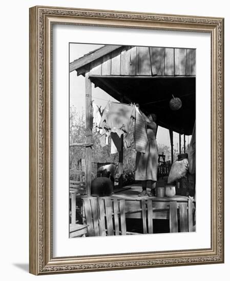 Old African American, Wife of Sharecropper, Lizzie Alexander Hanging Laundry to Dry on Her Porch-Alfred Eisenstaedt-Framed Photographic Print