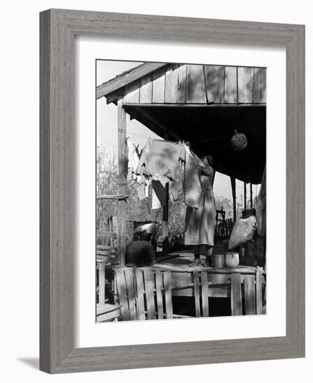 Old African American, Wife of Sharecropper, Lizzie Alexander Hanging Laundry to Dry on Her Porch-Alfred Eisenstaedt-Framed Photographic Print