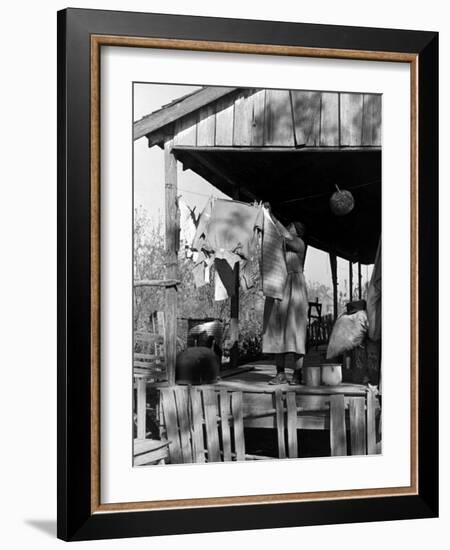 Old African American, Wife of Sharecropper, Lizzie Alexander Hanging Laundry to Dry on Her Porch-Alfred Eisenstaedt-Framed Photographic Print