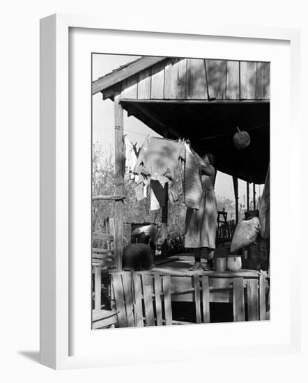 Old African American, Wife of Sharecropper, Lizzie Alexander Hanging Laundry to Dry on Her Porch-Alfred Eisenstaedt-Framed Photographic Print