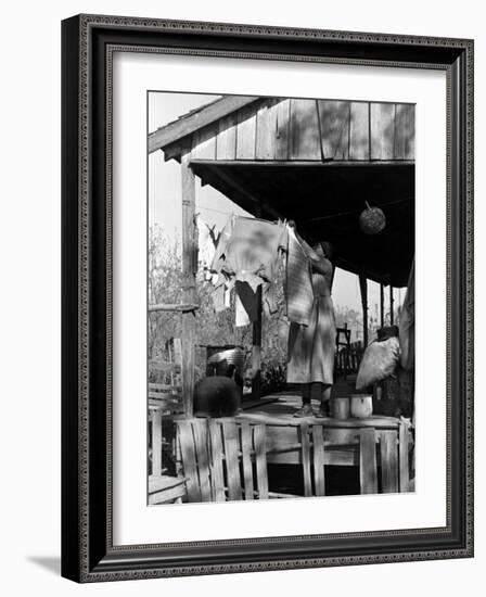 Old African American, Wife of Sharecropper, Lizzie Alexander Hanging Laundry to Dry on Her Porch-Alfred Eisenstaedt-Framed Photographic Print