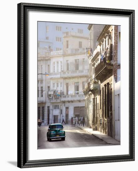 Old American Car Driving Along Quiet Street in Havana Centro, Havana, Cuba-null-Framed Photographic Print