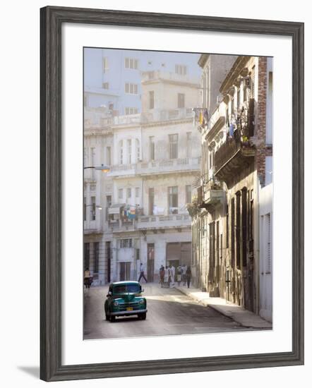 Old American Car Driving Along Quiet Street in Havana Centro, Havana, Cuba-null-Framed Photographic Print