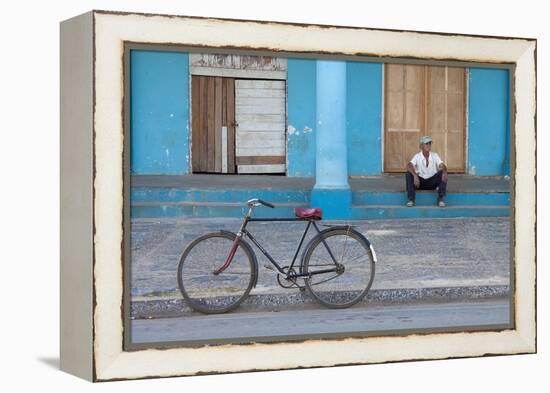 Old Bicycle Propped Up Outside Old Building with Local Man on Steps-Lee Frost-Framed Premier Image Canvas