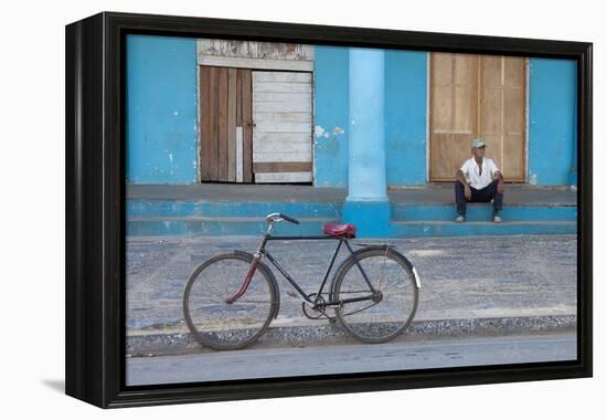 Old Bicycle Propped Up Outside Old Building with Local Man on Steps-Lee Frost-Framed Premier Image Canvas