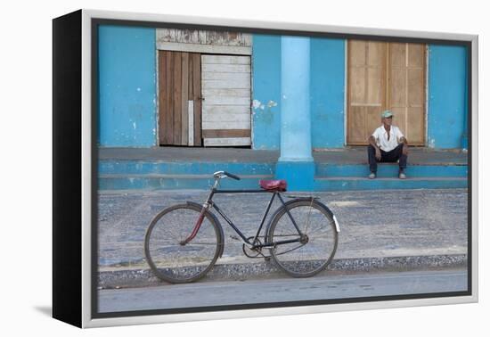 Old Bicycle Propped Up Outside Old Building with Local Man on Steps-Lee Frost-Framed Premier Image Canvas