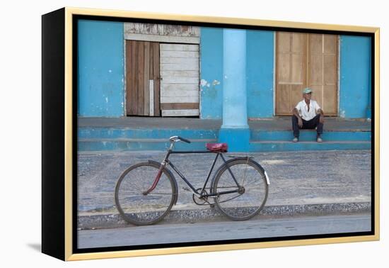 Old Bicycle Propped Up Outside Old Building with Local Man on Steps-Lee Frost-Framed Premier Image Canvas