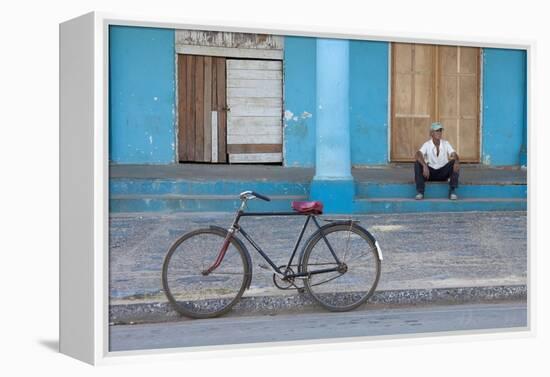 Old Bicycle Propped Up Outside Old Building with Local Man on Steps-Lee Frost-Framed Premier Image Canvas