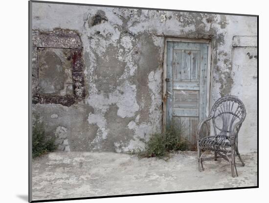 Old Building Chair and Doorway in Town of Oia, Santorini, Greece-Darrell Gulin-Mounted Photographic Print