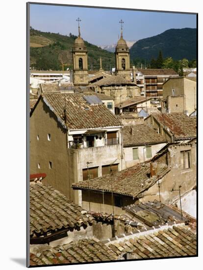 Old Buildings with Tiled Roofs and a Church Behind at Estella on the Camino in Navarre, Spain-Ken Gillham-Mounted Photographic Print