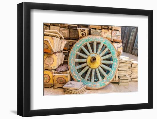 Old Cairo, Cairo, Egypt. Wooden cart wheel and floor tiles in an alley in Cairo.-Emily Wilson-Framed Photographic Print
