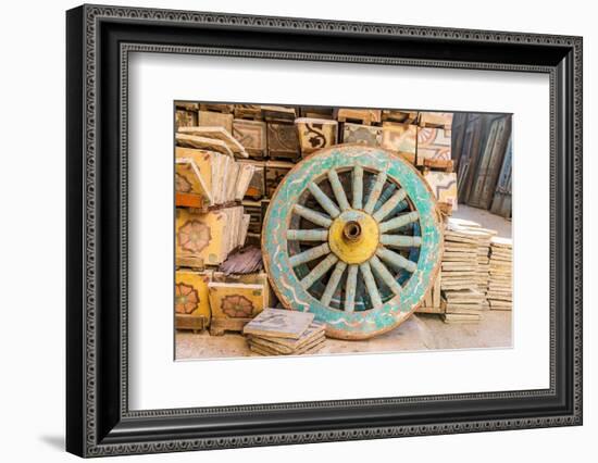 Old Cairo, Cairo, Egypt. Wooden cart wheel and floor tiles in an alley in Cairo.-Emily Wilson-Framed Photographic Print