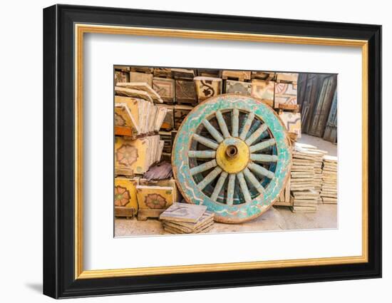 Old Cairo, Cairo, Egypt. Wooden cart wheel and floor tiles in an alley in Cairo.-Emily Wilson-Framed Photographic Print