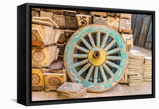 Old Cairo, Cairo, Egypt. Wooden cart wheel and floor tiles in an alley in Cairo.-Emily Wilson-Framed Premier Image Canvas