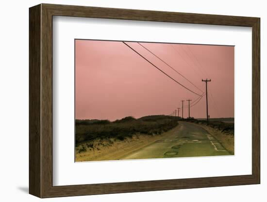 Old Curved Road through Deserted Coastline at Sunset under a Soft Pink Sky-Sanghwan Kim-Framed Photographic Print