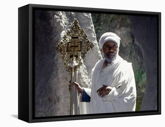 Old Ethiopian Orthodox Priest Holds a Large Brass Coptic Cross at Rock-Hewn Church of Adadi Maryam-Nigel Pavitt-Framed Premier Image Canvas