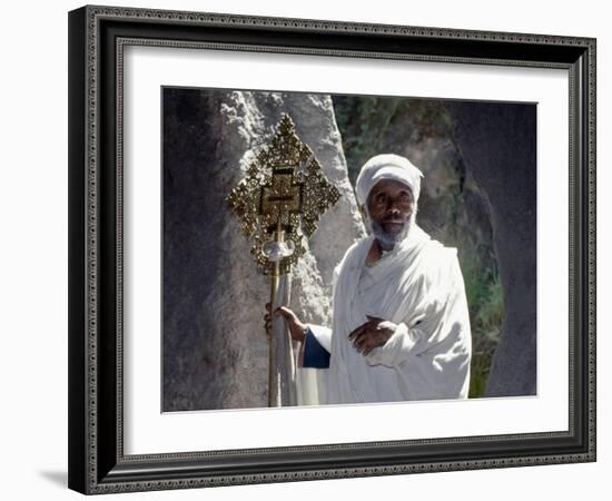 Old Ethiopian Orthodox Priest Holds a Large Brass Coptic Cross at Rock-Hewn Church of Adadi Maryam-Nigel Pavitt-Framed Photographic Print