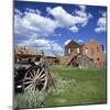 Old Farm Wagon and Derelict Wooden and Brick Houses at Bodie Ghost Town, California, USA-Tony Gervis-Mounted Photographic Print