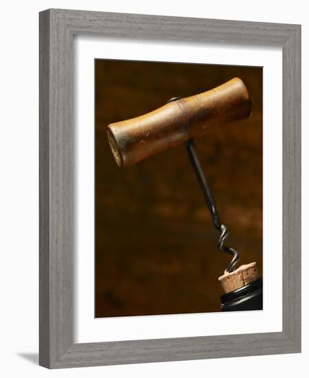 Old-Fashioned Corkscrew Uncorking Bottle-Steve Lupton-Framed Photographic Print