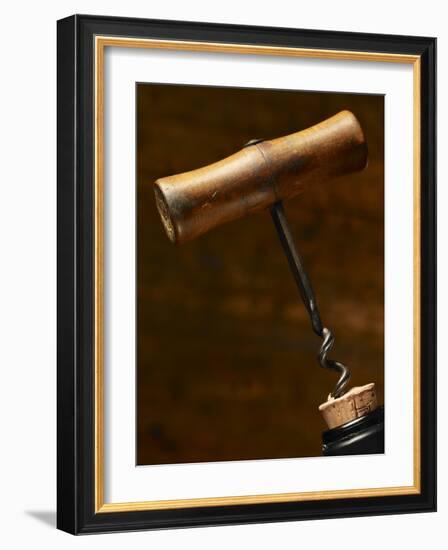 Old-Fashioned Corkscrew Uncorking Bottle-Steve Lupton-Framed Photographic Print