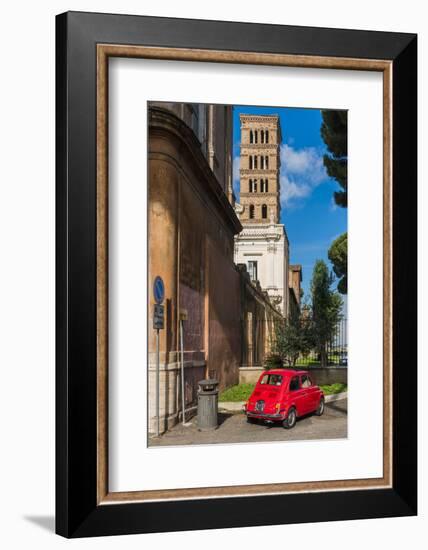 Old Fiat 500 car parked with Basilica dei Santi Bonifacio ed Alessio in the background, Rome, Lazio-Stefano Politi Markovina-Framed Photographic Print