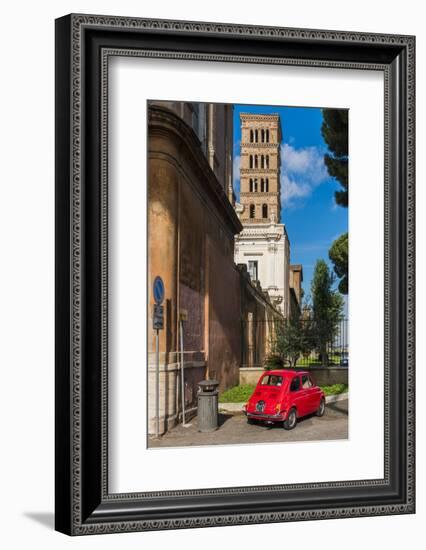 Old Fiat 500 car parked with Basilica dei Santi Bonifacio ed Alessio in the background, Rome, Lazio-Stefano Politi Markovina-Framed Photographic Print