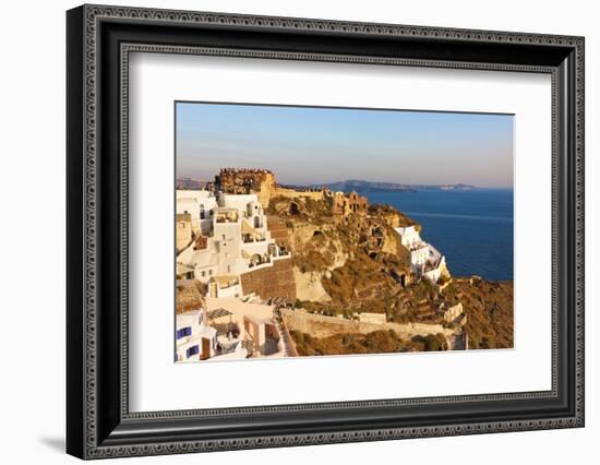 Old fortress and houses on the coast of Aegean Sea. Oia, Santorini Island, Greece-Keren Su-Framed Photographic Print