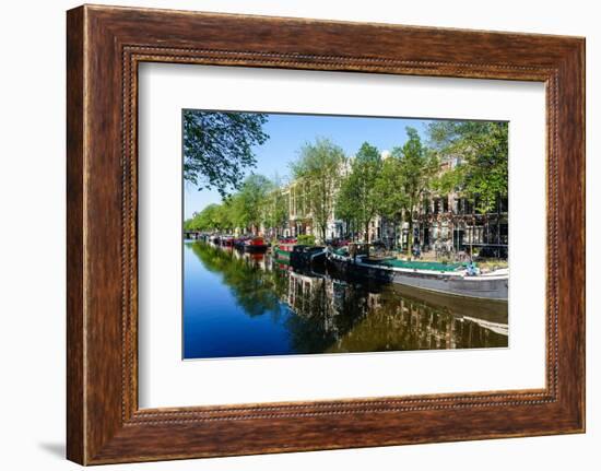 Old gabled buildings reflecting in a canal, Amsterdam, North Holland, The Netherlands-Fraser Hall-Framed Photographic Print