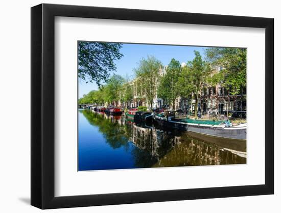 Old gabled buildings reflecting in a canal, Amsterdam, North Holland, The Netherlands-Fraser Hall-Framed Photographic Print