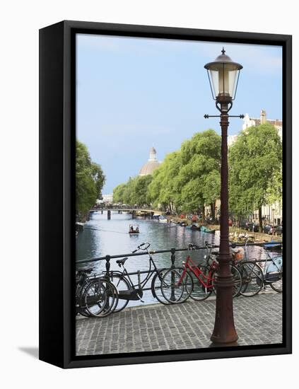 Old Gas Lamp Post and Bicycles on a Bridge over a Canal in Amsterdam, the Netherlands-Miva Stock-Framed Premier Image Canvas