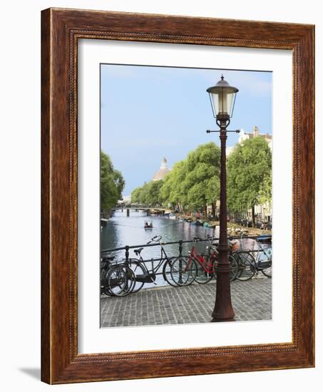 Old Gas Lamp Post and Bicycles on a Bridge over a Canal in Amsterdam, the Netherlands-Miva Stock-Framed Photographic Print