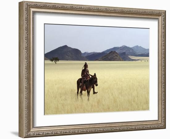 Old Himba Woman, Upright Despite Her Years, Rides Her Donkey Through Harsh Land-Nigel Pavitt-Framed Photographic Print