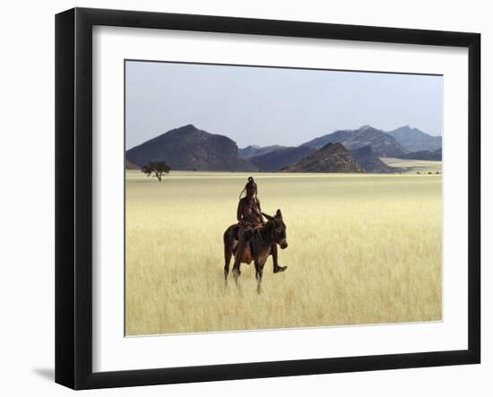 Old Himba Woman, Upright Despite Her Years, Rides Her Donkey Through Harsh Land-Nigel Pavitt-Framed Photographic Print