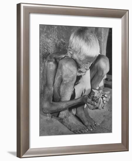 Old Indian Man Holding Handful of Leaves He Will Boil and Eat During Famine Caused by Drought-null-Framed Photographic Print