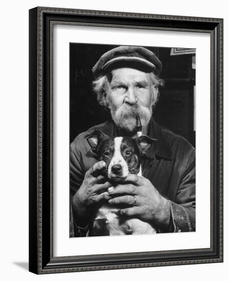 Old Man Holding His Hands around a Dog's Throat-Dmitri Kessel-Framed Photographic Print