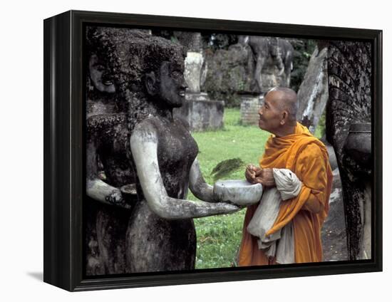 Old Monk Praying at Xieng Khuan (Buddha Park), Laos-Keren Su-Framed Premier Image Canvas