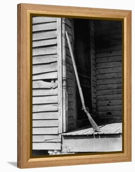 Old Rifle Leaning Up a Wall on the Porch of an Old House-Andreas Feininger-Framed Premier Image Canvas