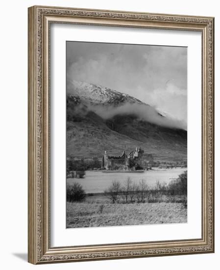 Old Scottish Castle Standing on a River Peninsula, with Mountain Rising in Background-Nat Farbman-Framed Photographic Print