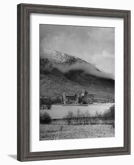 Old Scottish Castle Standing on a River Peninsula, with Mountain Rising in Background-Nat Farbman-Framed Photographic Print