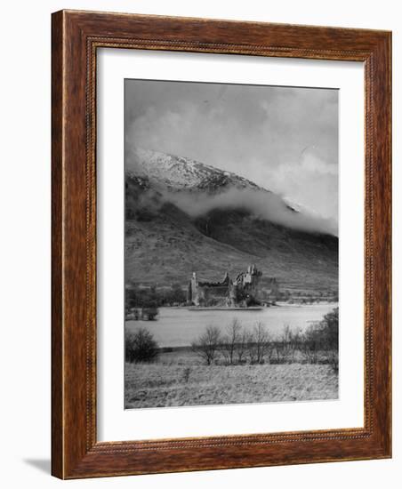 Old Scottish Castle Standing on a River Peninsula, with Mountain Rising in Background-Nat Farbman-Framed Photographic Print