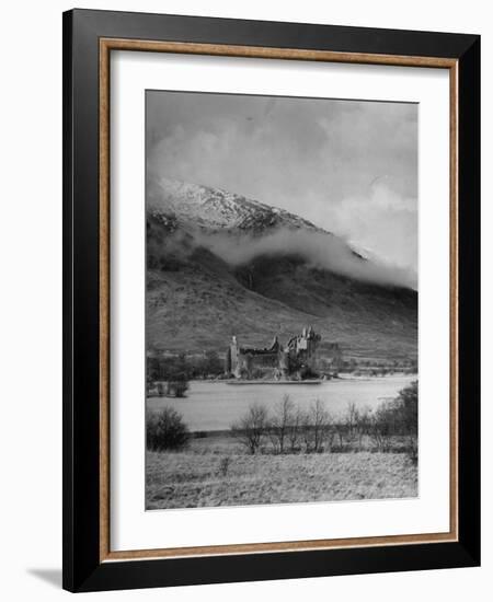 Old Scottish Castle Standing on a River Peninsula, with Mountain Rising in Background-Nat Farbman-Framed Photographic Print