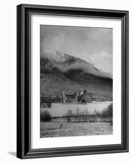 Old Scottish Castle Standing on a River Peninsula, with Mountain Rising in Background-Nat Farbman-Framed Photographic Print