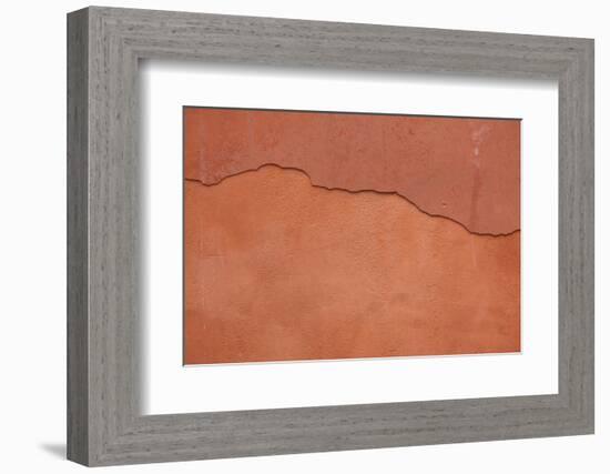 Old Terracotta Painted Stucco Wall with Cracked Plaster. Backgro-wrangel-Framed Photographic Print