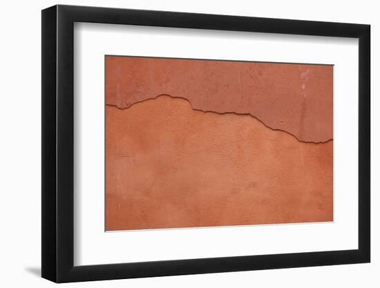 Old Terracotta Painted Stucco Wall with Cracked Plaster. Backgro-wrangel-Framed Photographic Print