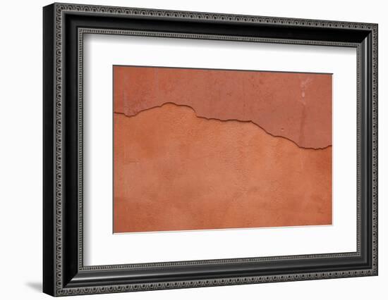 Old Terracotta Painted Stucco Wall with Cracked Plaster. Backgro-wrangel-Framed Photographic Print