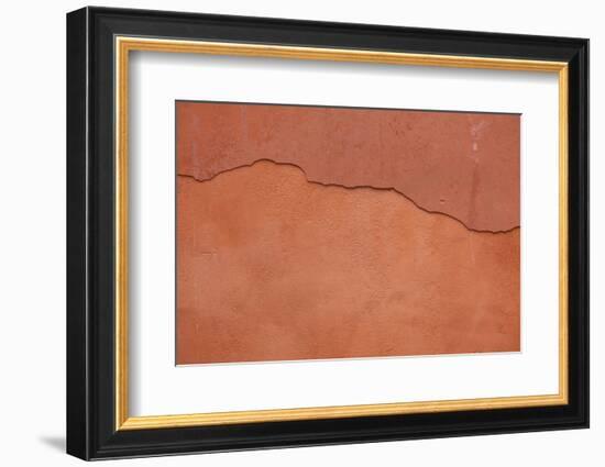 Old Terracotta Painted Stucco Wall with Cracked Plaster. Backgro-wrangel-Framed Photographic Print